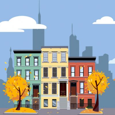 Colorful row houses with yellow autumn trees against a city skyline backdrop