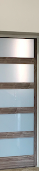 Modern glass and wood sliding closet door with horizontal metal frames